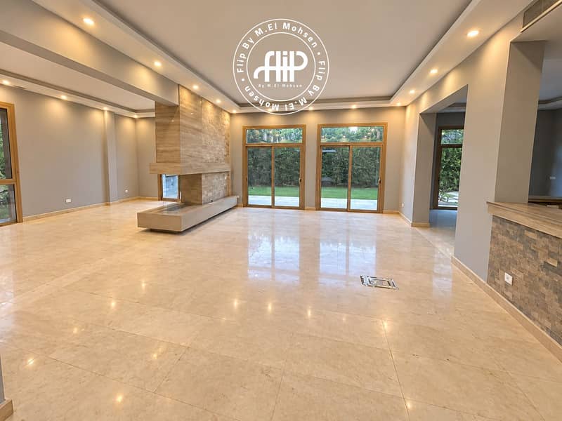 3 Modern Living Room with Stone Fireplace and Garden Views. png