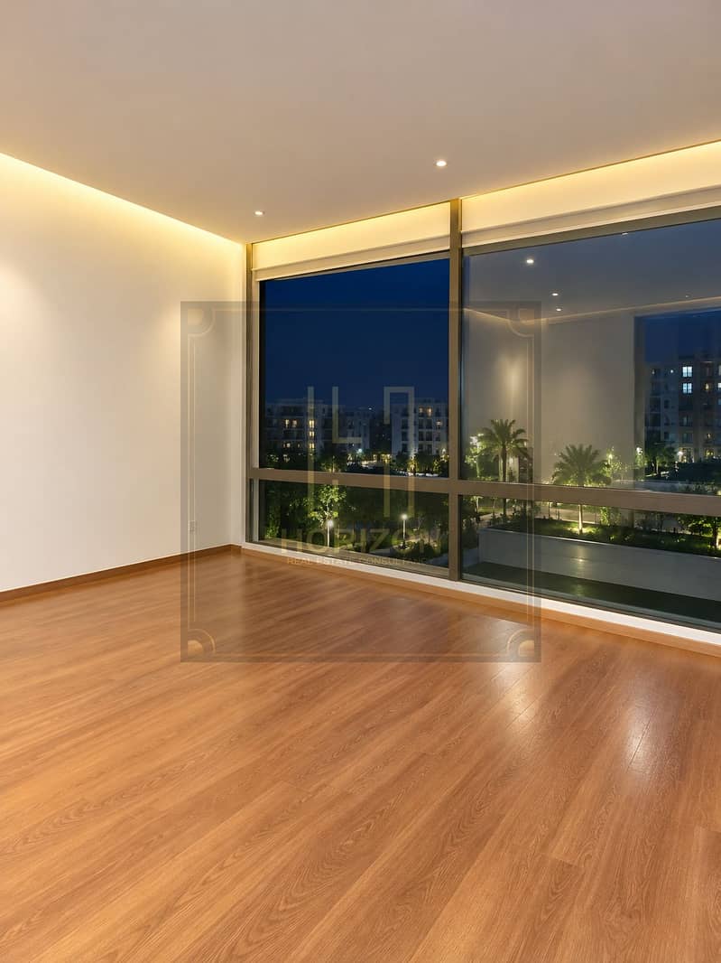 3 Warm Minimalist Room with Nighttime City View. png