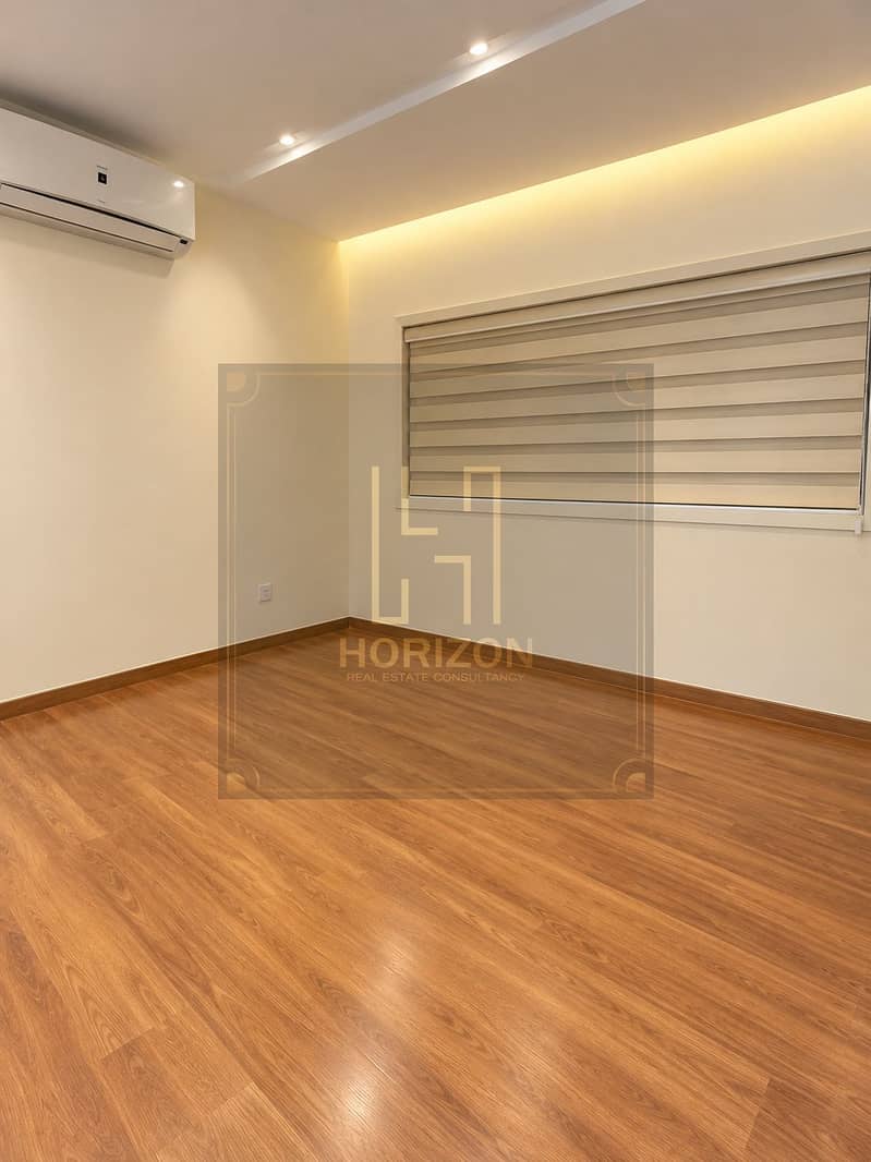 4 Warm Minimalist Room with Wood Flooring. png