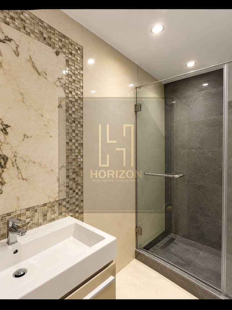 7 Modern Marble Bathroom with Glass Shower. png