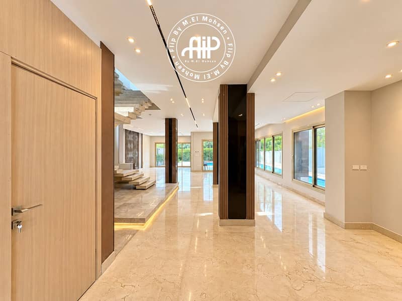 2 Bright Modern Foyer with Floating Staircase. png