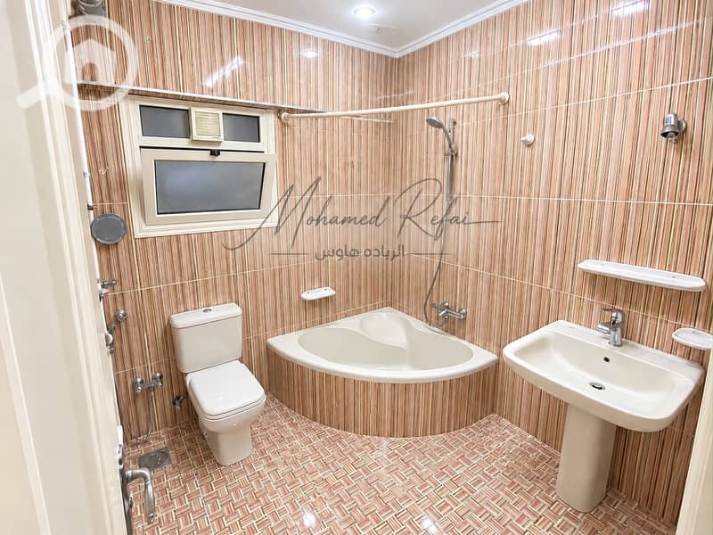 4 Modern Beige-Striped Bathroom with Signature. png