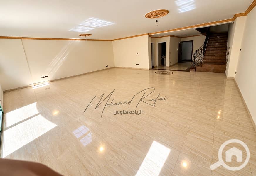 2 Sunlit Luxury Living Space with Staircase. png