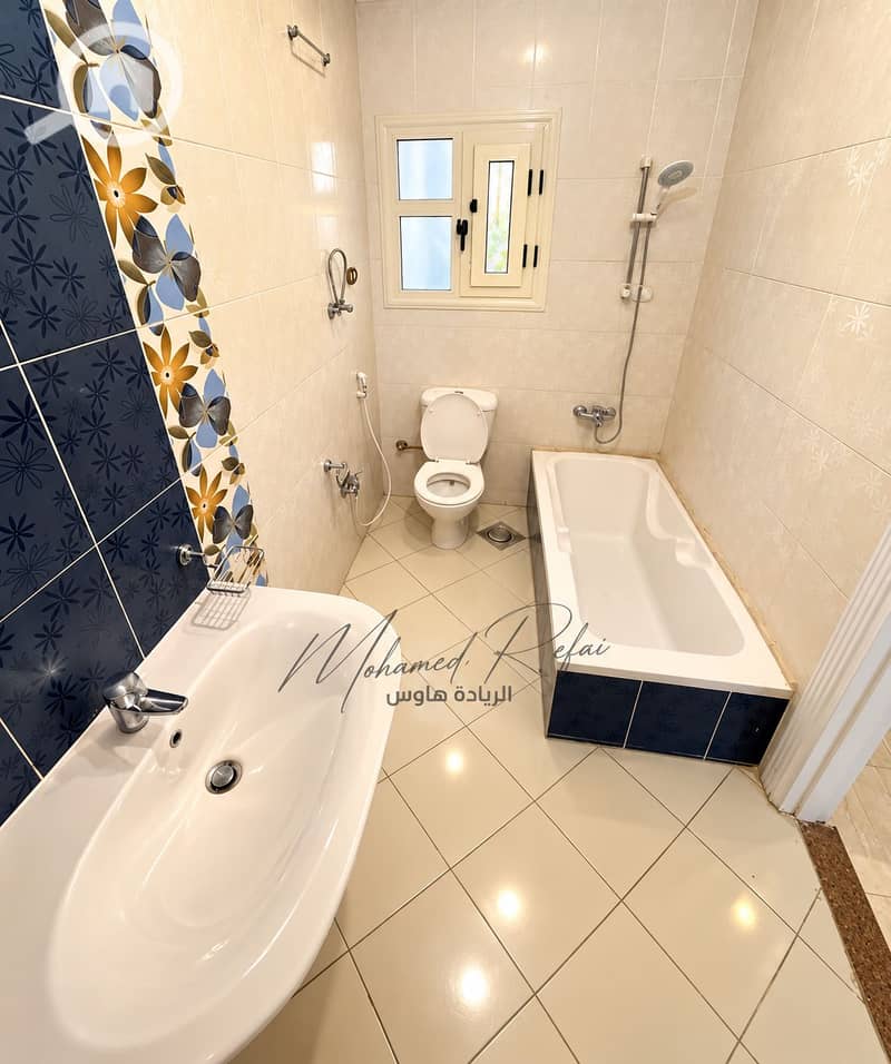 5 Bright Modern Bathroom with Floral Tile Accents. png