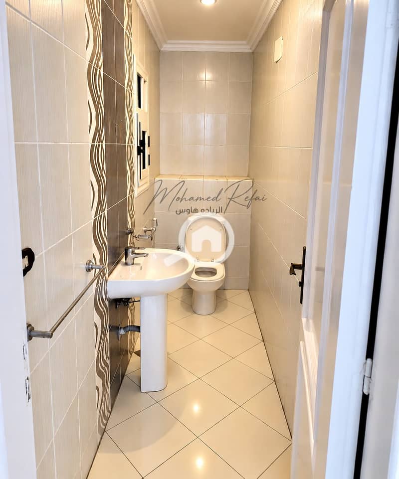 8 Bright Narrow Bathroom with Elegant Tile Details. png
