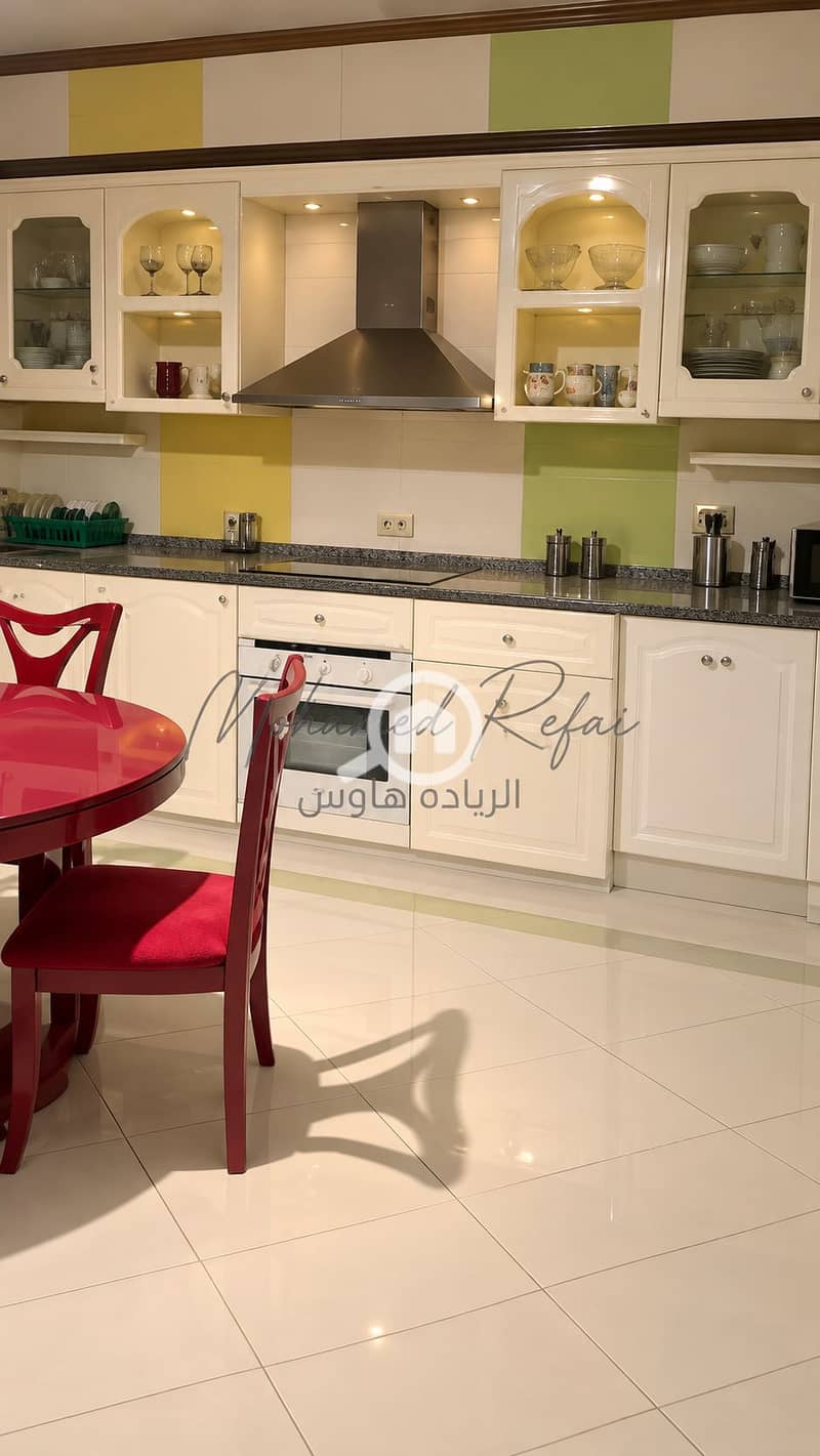 5 Polished Kitchen with Red Dining Set. png