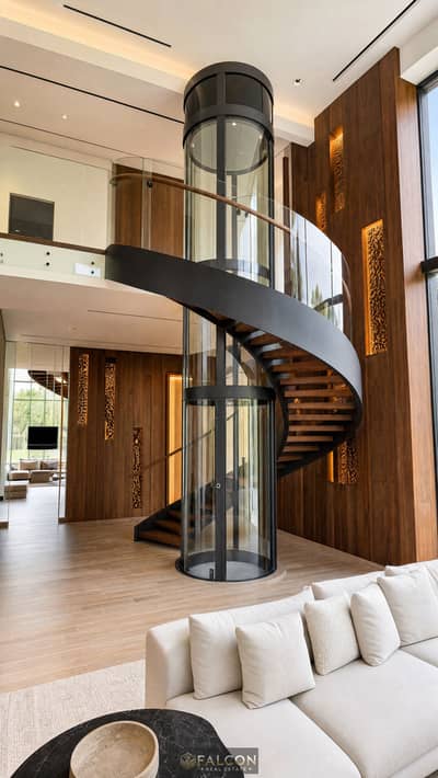 5 Bedroom Villa for Sale in New Cairo, Cairo - Double-Height Living Room with Sculptural Glass Elevator _ M-System Elevator. png 5 Bedroom Villa for Sale in New Cairo, Cairo - Double-Height Living Room with Sculptural Glass Elevator _ M-System Elevator. png